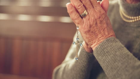 senior, woman and praying with rosary in church