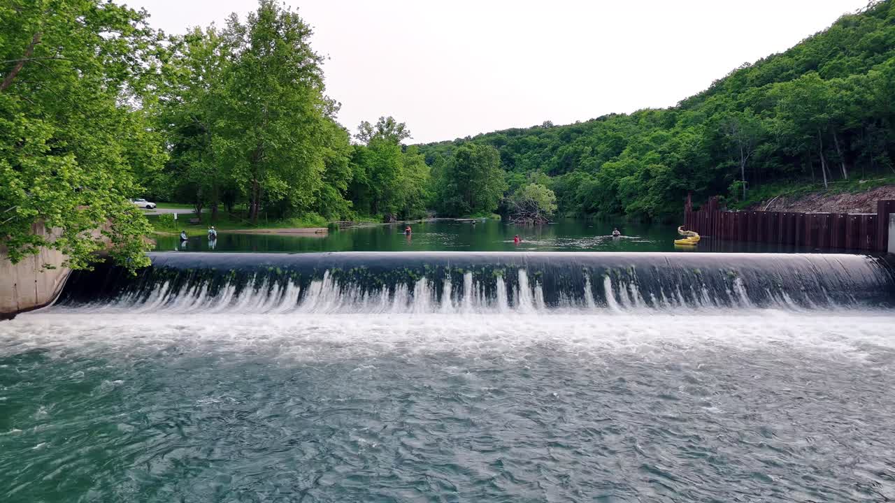 A group of fishermen fly-fish in the clear spring water at Bennett Spring State Park in Lebanon, Missouri