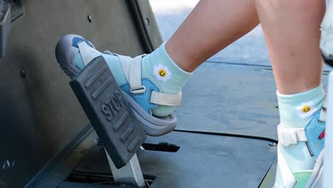 foot operating pedal in electric golf cart