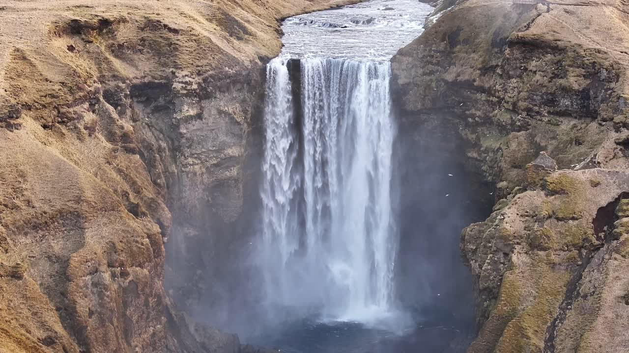 Static aerial shot of Skógafoss waterfall in Skógar, Rangárþing eystra, Iceland.
