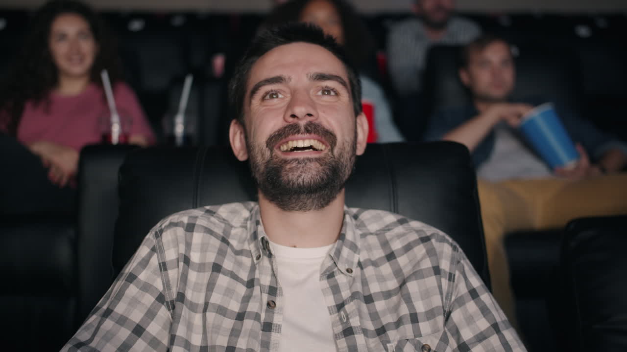 Man Enjoying Movie at the Theater