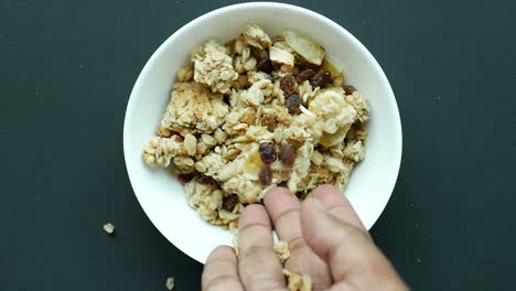 granola with raisins and almonds in a bowl