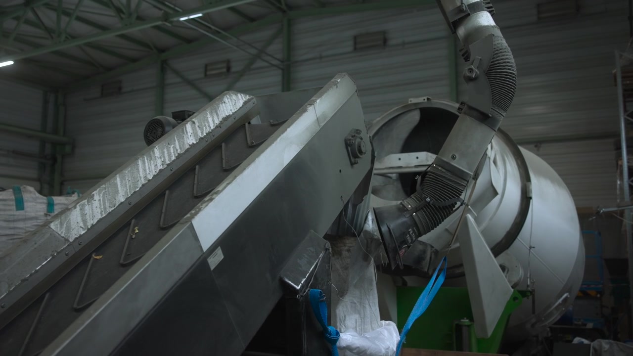 Industrial Drum Machine Processing Bulk Recyclables With Angled Conveyor And Large Ducts Metal Surfaces, Worn