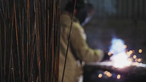 metal rods on a blurred background of welding