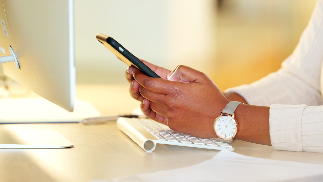 Closeup of a business woman texting on a phone