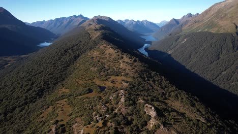 aerial scenic view of fiordland national park in the morning, high mountain peaks and lakes in valley