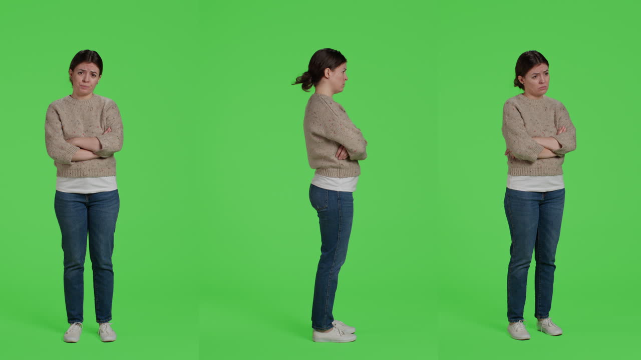 Upset Woman with Arms Crossed on Green Screen