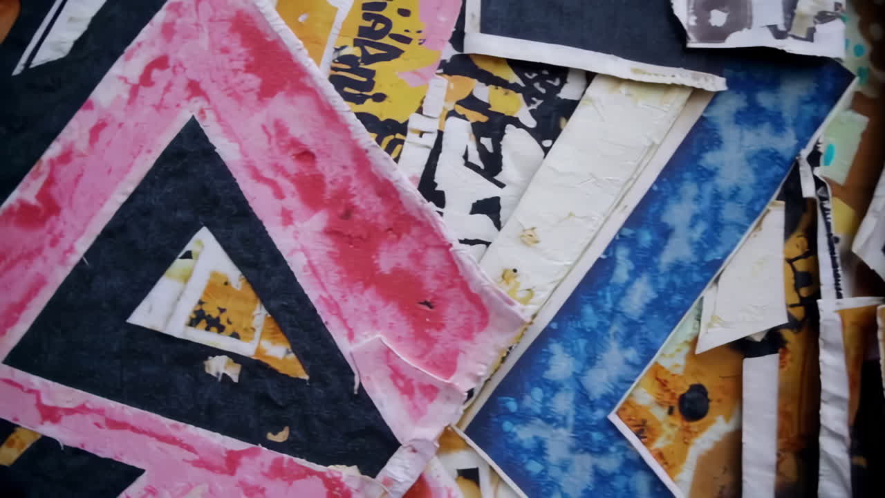 Torn Posters and Graffiti on a Wall