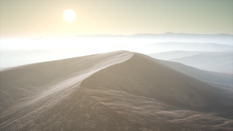 red sand desert dunes in fog