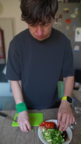 person preparing a salad at home