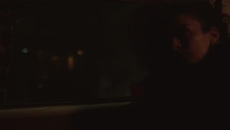 girlfriends riding together in car at night