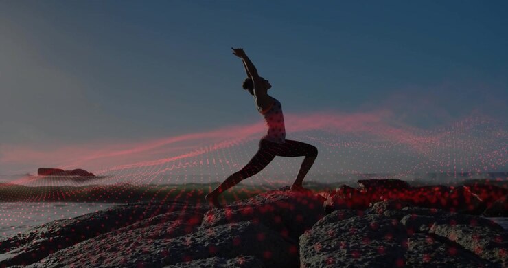 Donna che pratica yoga su scogli oceanici con sovrapposizione digitale futuristica