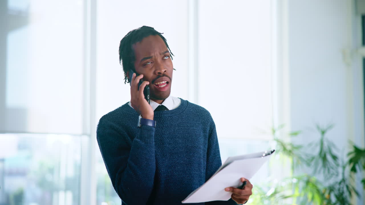 Man Talking On The Phone In An Office