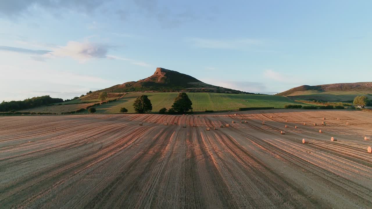 Harvest time at Aireyholme Farm in the shadow of Roseberry Topping, North York Moors National Park