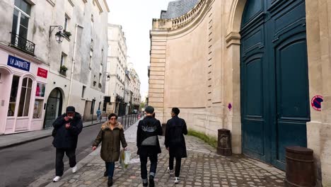 people walking down a charming urban street