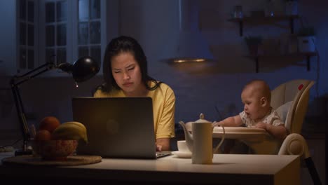 working mom with baby at home night