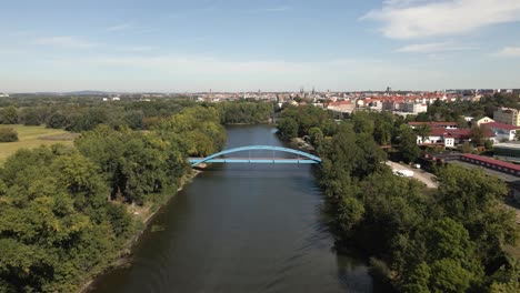 aerial view of a boat in the water near blue bridge in halle germany,