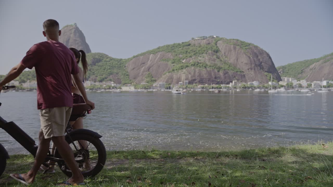 Couple with E-bike by the Water in Rio de Janeiro