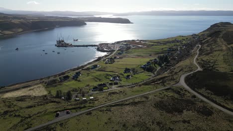 High-altitude-track-of-Highland-roads-above-fishing-port-at-Idrigil-Bay-Uig-Isle-of-Skye-Scotland