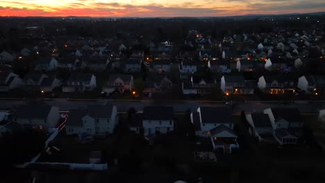 bright sunset over dark american neighborhood with modern two story houses