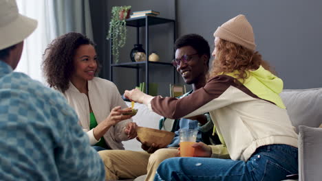 four friends eating at home