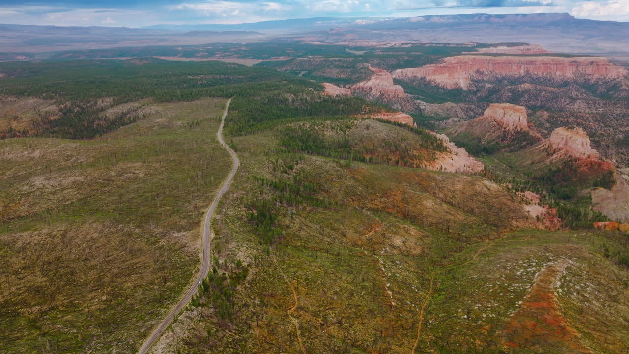 Stunning picturesque view of Zion National Park in Utah, USA. Drone descending over the road going through rocky landscape.