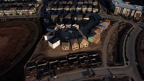 a drone shot of houses under construction in yorkville, calgary, canada