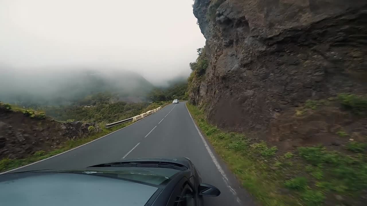 Driving on a Foggy Mountain Road