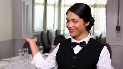 pretty waitress smiling at the camera