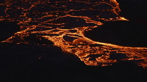 red hot lava flow during volcanic eruption in geldingadalir, fagradalsfjall mountain, south iceland - close up