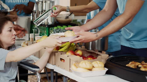 poor wheelchair user receiving free food