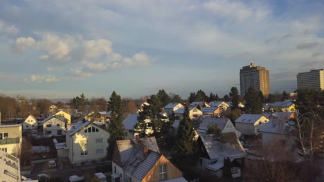 AERIAL:-Close-up-Houses-covered-with-beautiful-white-snow,-Sunny,-Winter,-Germany
