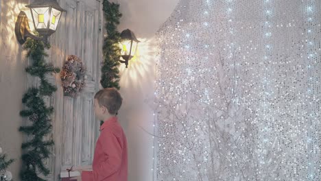 son in red shirt knocks on beautiful vintage door