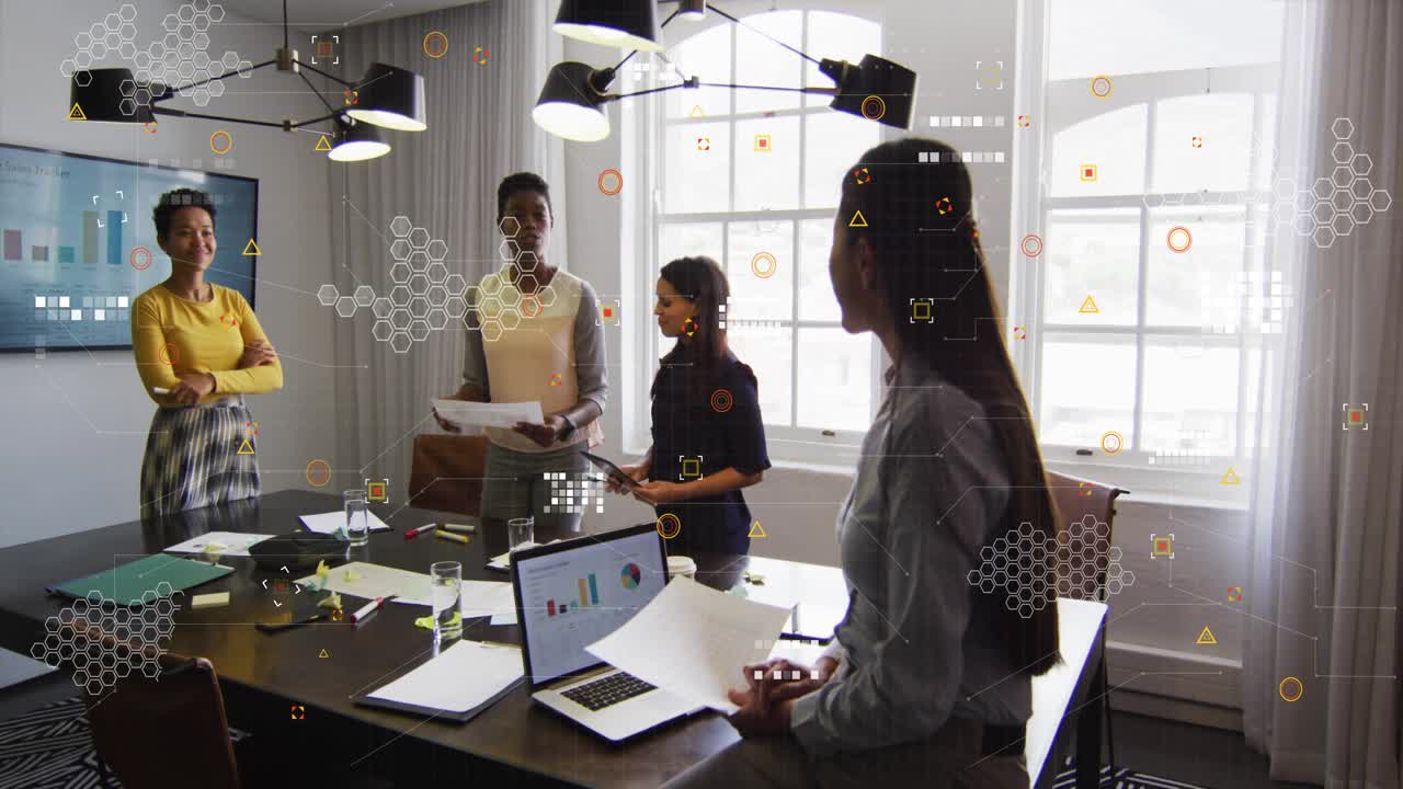 Four women in business meeting, presenter reading docs sparking HUD overlay linking docs and charts