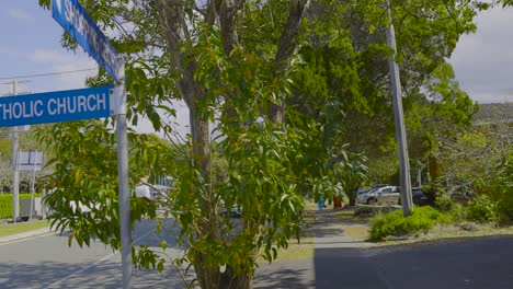 signpost near tree at currumbin beach