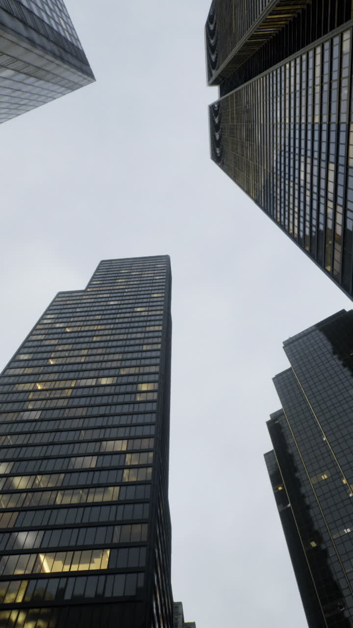Tall skyscrapers rising towards the cloudy sky in an urban setting