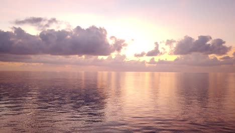 cinematic 4k tilt up of sunset on waves of indian ocean in bay of bengal, andaman islands, india