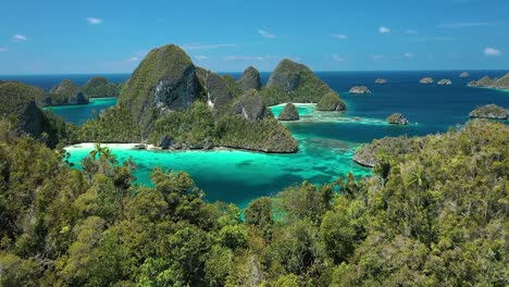 Excellent-Aerial-Shot-Of-Peaks-On-The-Wayag-Islands,-Raja-Ampat,-Indonesia