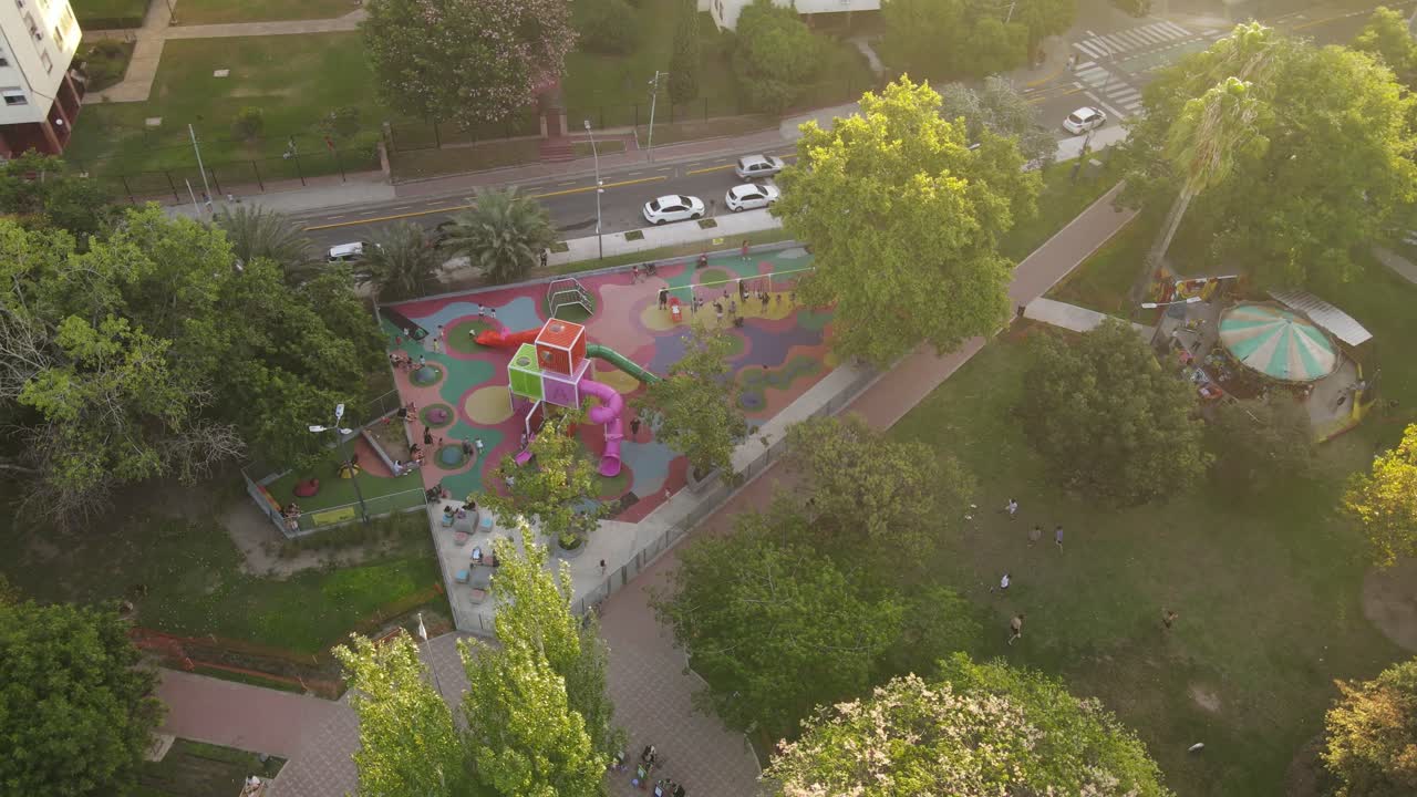 Kids playing at children's playground in Buenos Aires City, aerial shot