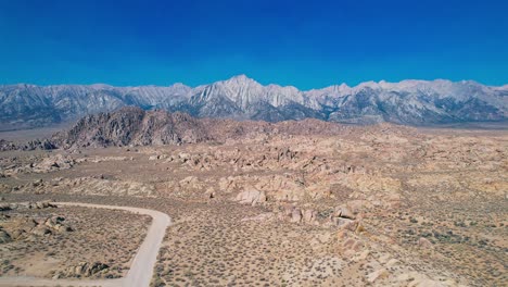 alabama hills in lone pine california 4k drone footage long pull back shot over movie road with mount whitney in the background