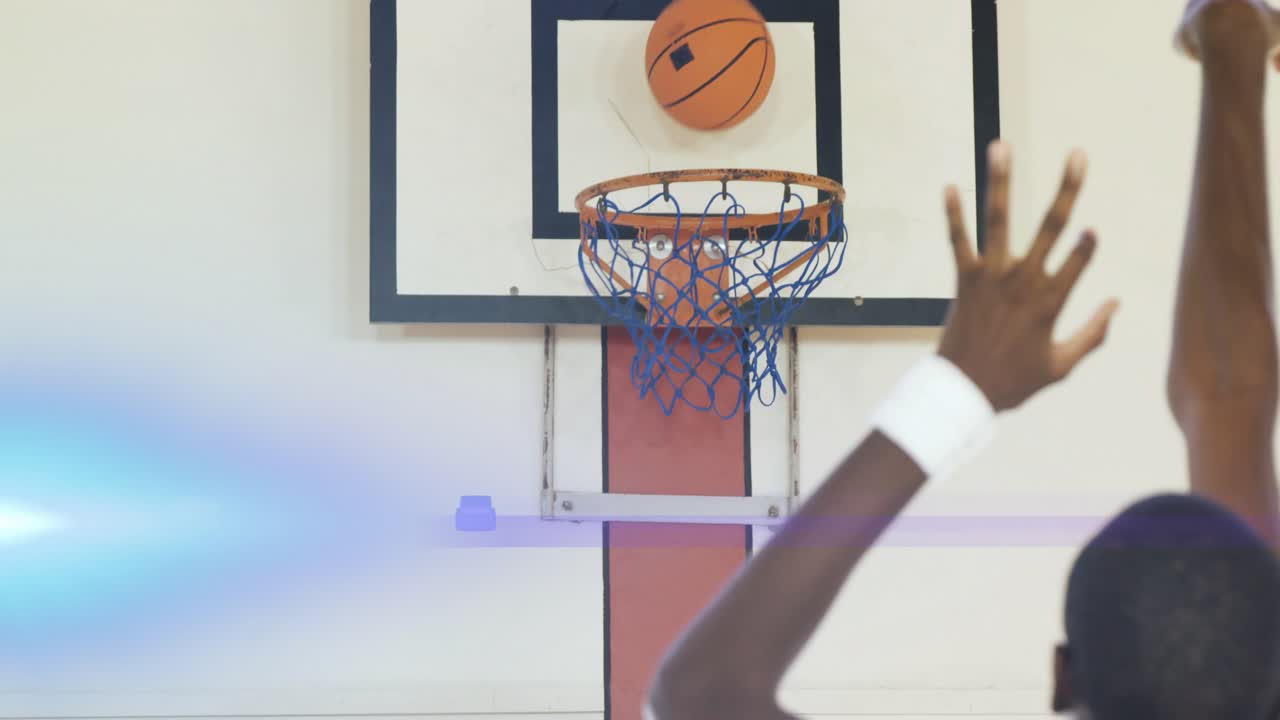 Male basketball player starting with ball at head, lining up and releasing shot, aiming to score