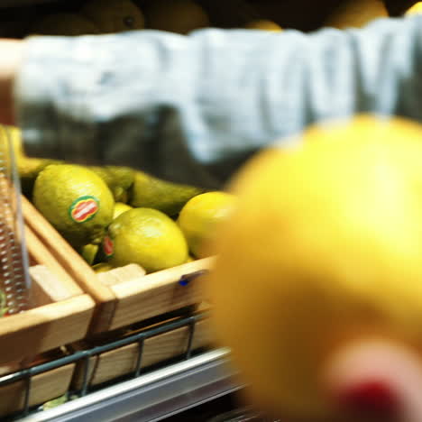 woman's hand chooses fruit and vegetables from a food counter in a supermarket. healthy lifestyle. vegetarianism. proper nutrition. square video