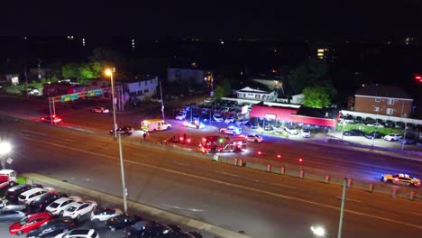 emergency services respond to nighttime accident on city street