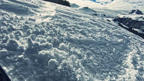 Snowboard-breaking-through-the-snow