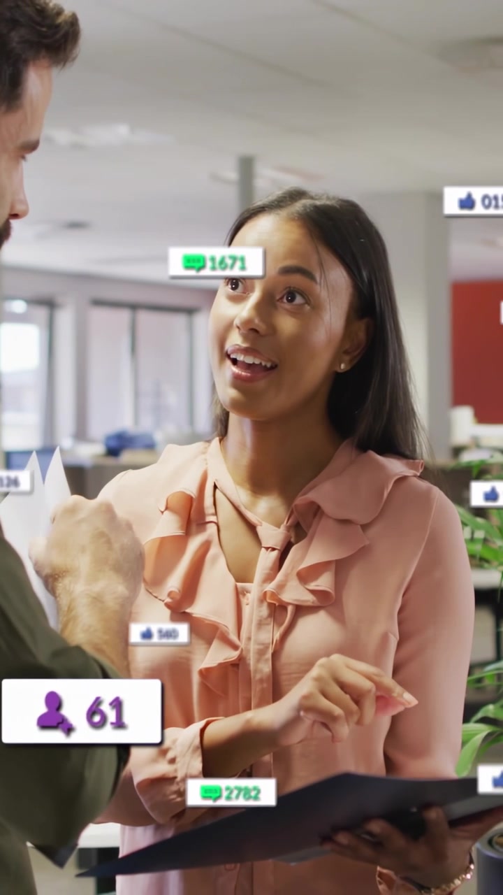 Vertical video: Woman pointing at black folder showing marketing KPIs while social icons animating