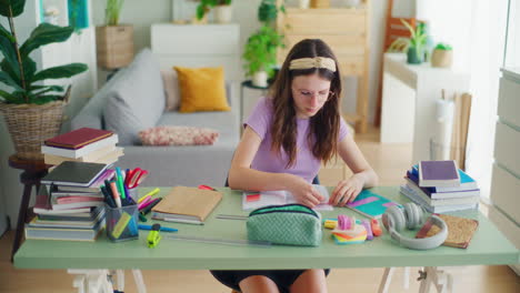 concentrated young student doing homework and solving math problems while studying for school