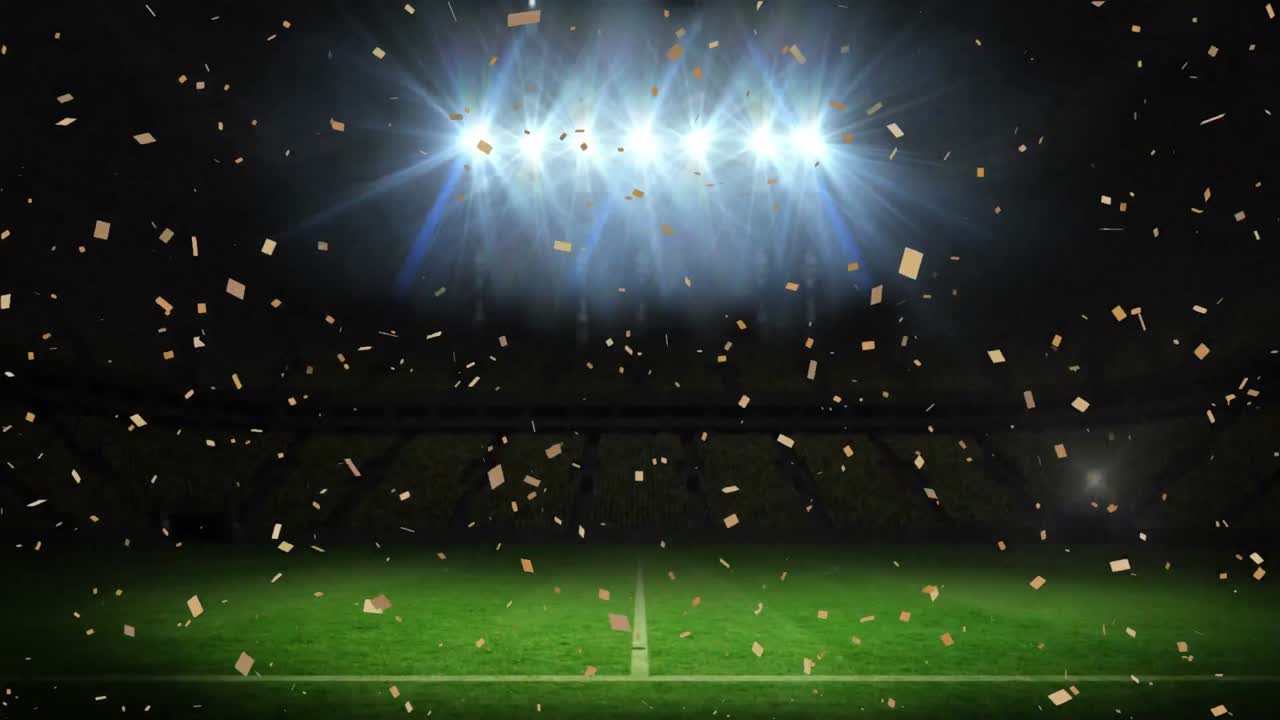 밤에 스포츠 스타디움에서 홍수 조명 피치 위에 떨어지는 콘페티의 애니메이션