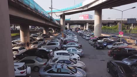 Bangkok-in-Thailand,-Drone-shot-of-a-congested-car-park