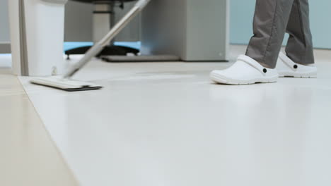 cleaner mopping the floor