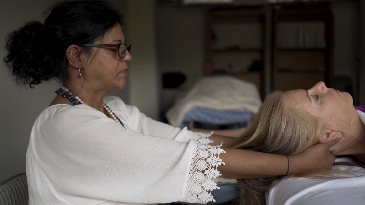 Woman receiving a neck massage